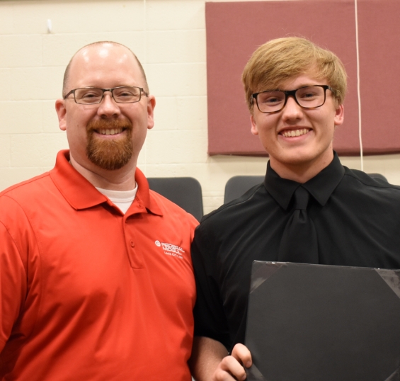Federal-Mogul TPLiners Scholarship. One $1,000 award. From left: presenter Kory Robinson and recipient Aidan Carlson.