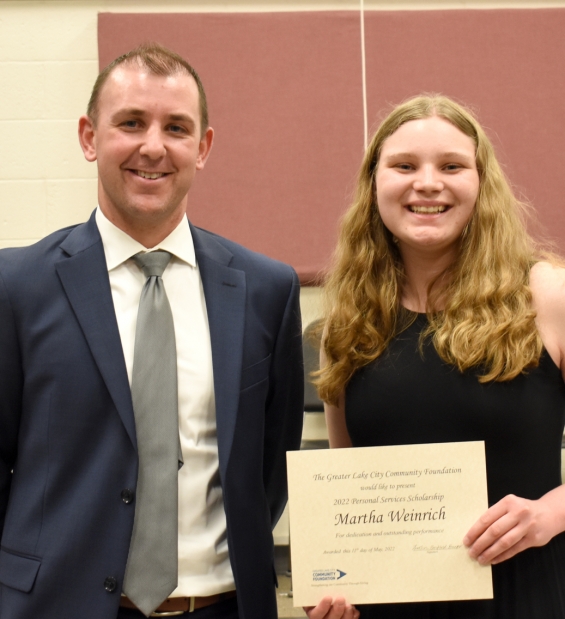 Greater Lake City Community Foundation Personal Services Scholarship. One $1,500 award. From left: presenter Steve Lang and recipient Martha Weinrich.