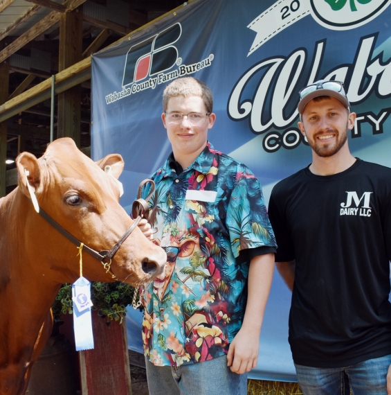 Jonathan Raths of the Minnesota Midgets with buyer Nick Miller.