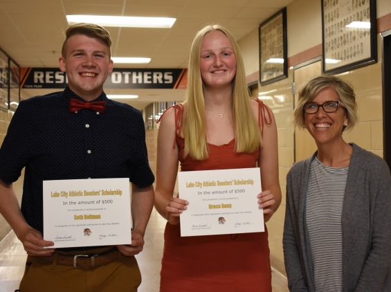 Lake City Athletic Booster Club Scholarship - two $500 awards. From left: recipients Seth Heitman and Grace Bany and presenter Dena Huettl.