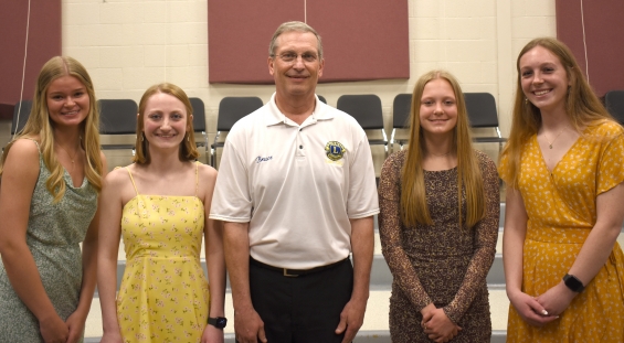 Lake City Lions Club. Four $500 awards. From left: recipients Emma Marchini-Moyer and Makaila Solheid, presenter Bruce Carlstrom, and recipients Carly Earnest Miller, and Mikayla Arendt.