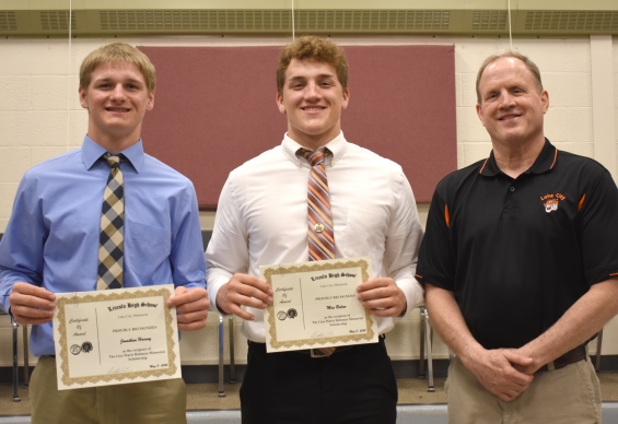 Lisa Marie Heitman Memorial Scholarship. Two $500 awards. From left: recipients Jonathan Harvey and Max Balow, and presenter Doug Vaith.