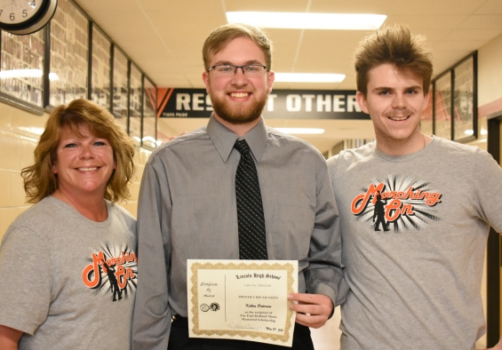Paul Holland Music Memorial Scholarship - $1,000. Recipient Kellen Peterson (center) with presenters Amy Holland (left) and Victor Holland.