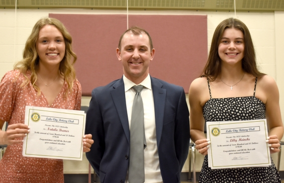 Rotary Club of Lake City. Two $750 awards. From left: recipient Natalie Bremer, presenter Steve Lang, and recipient Lilly Meincke.