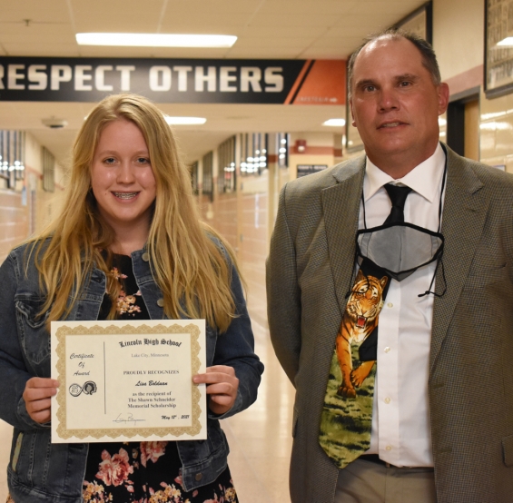 Shawn Schneider Memorial Scholarship - $500. Recipient Lisa Bolduan (left) with presenter Perry Iberg.