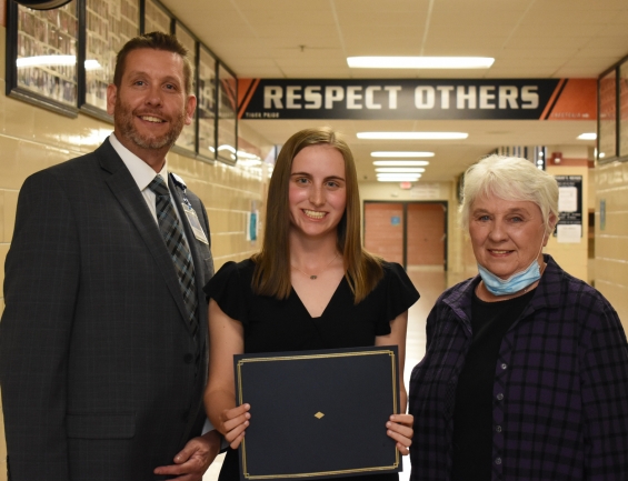 Dr. Stephen E. Dudley Memorial Child of Employee Scholarship - $1,000. From left: presenter Chris Gulden, recipient Molly Kennedy, and presenter Pixie Dudley.
