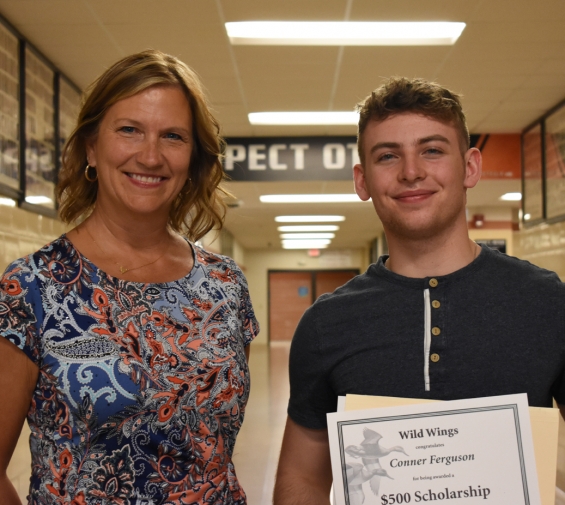 Wild Wings Scholarship - $500. Recipient Conner Ferguson (right) with presenter Sara Koller.