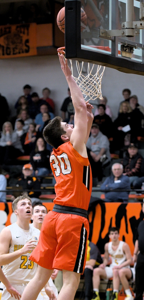 Brady Schurhammer goes in for a layup against Plainview last Thursday. Schurhammer recorded 11 points for Lake City. —Photo by Dave Ender