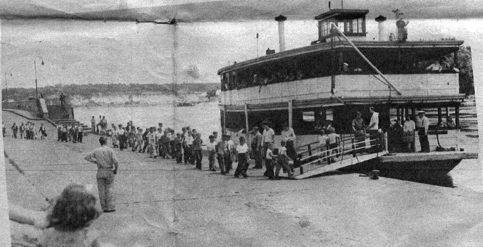This image from a 1946 Pioneer Press shows children on a YMCA “Mystery Hike” boarding the Donna Mae in St. Paul.