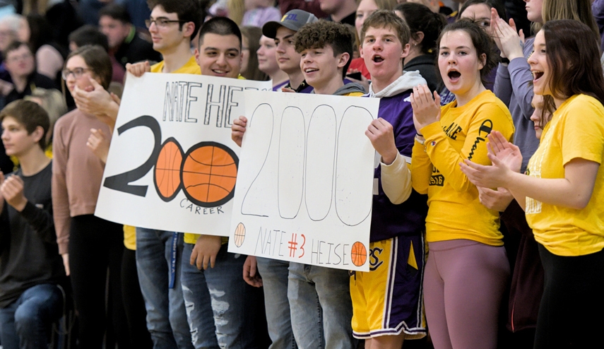 Tiger basketball fans prepared signs to honor Nate Heise in recording his 2,000th career point last Thursday.