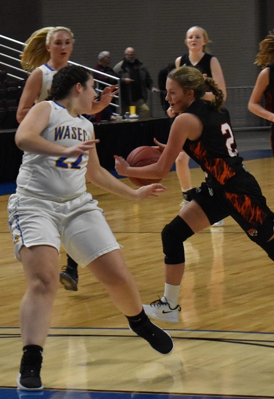 Paige West drives to the basket after a steal for two of her career-high 10 points.
