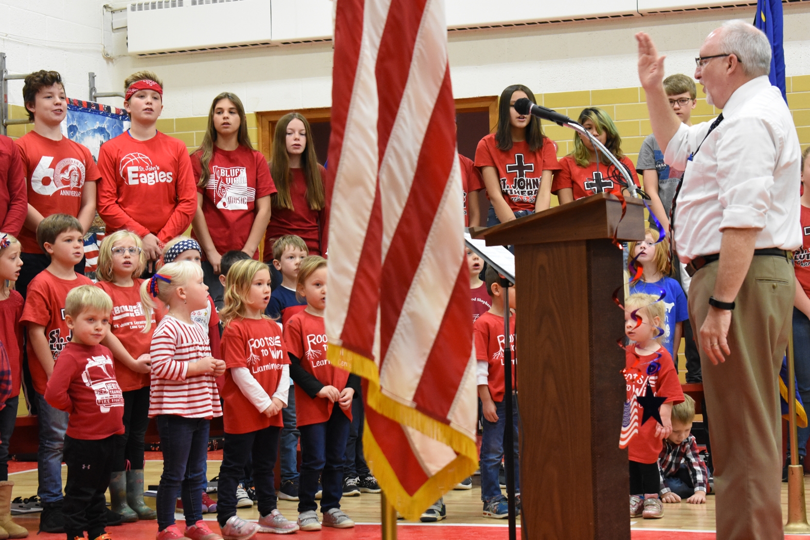 St. John’s Lutheran School students sing under the direction of Principal David Zabel.