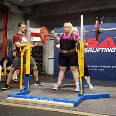 Kristi Gross prepares to do a squat at the Med City Raw Open.
