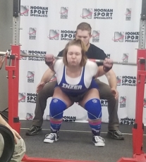 Lydia Gross performs a squat powerlift at the Alexandria meet and sets a personal record at 121 pounds.